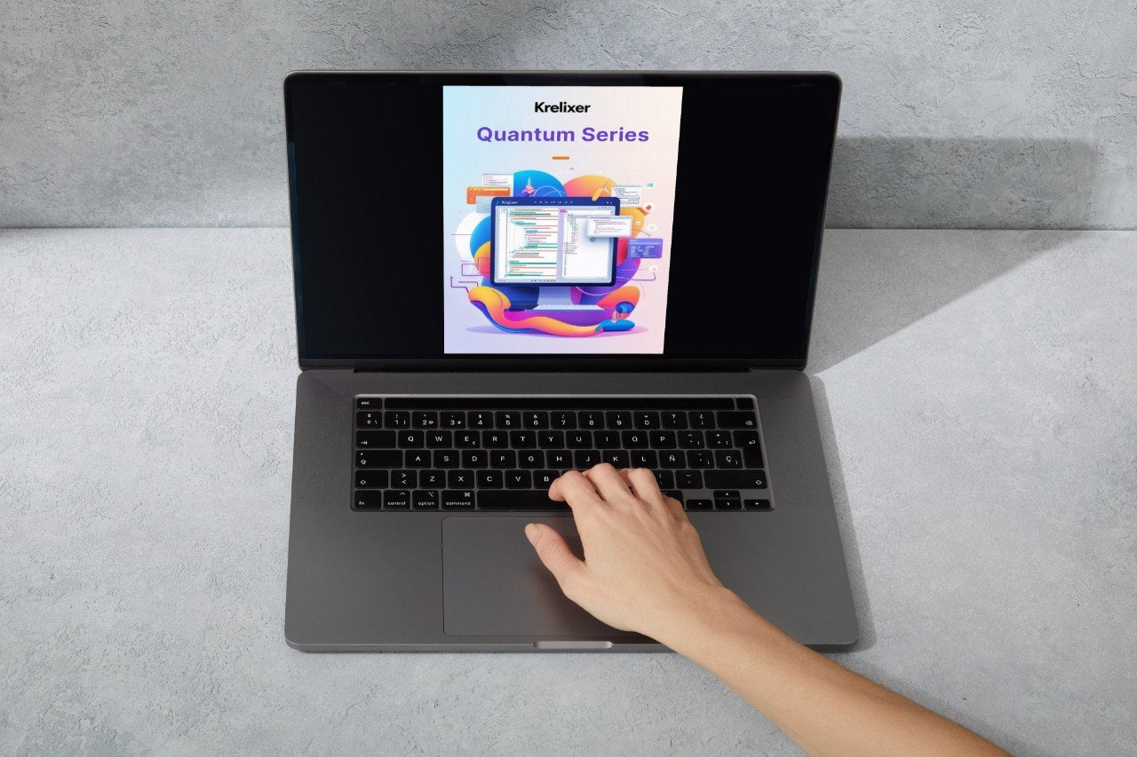 Person using a laptop with a screen displaying 'Kreitzer Nexus Course' on a gray surface.